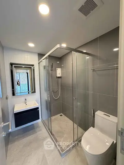 Modern bathroom with sleek shower enclosure and stylish fixtures
