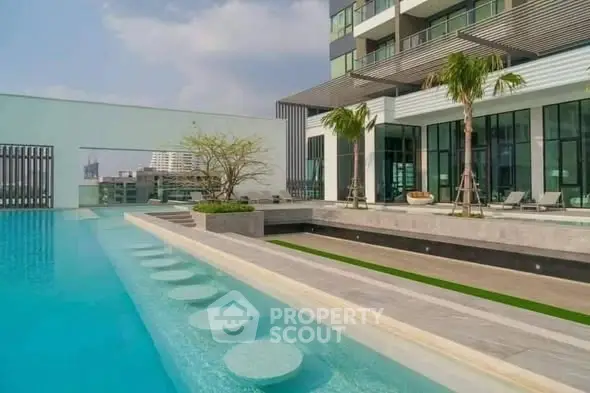Luxurious modern building with stunning rooftop pool and city views.