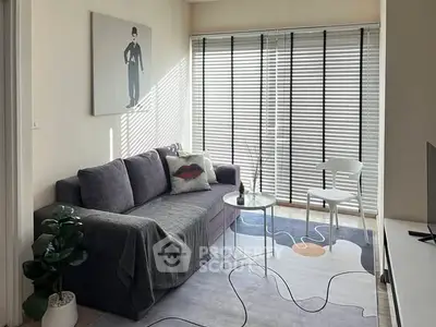 Chic modern living room with stylish decor and ample natural light.