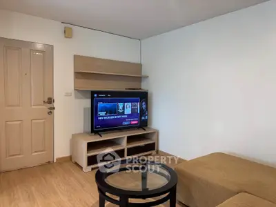 Cozy living room with modern TV setup and stylish furniture