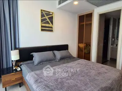 Modern bedroom with stylish decor and cozy ambiance in a contemporary apartment.