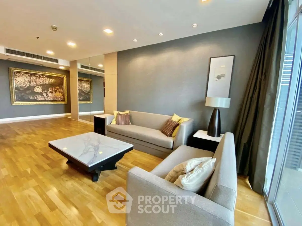 Spacious modern living room with elegant decor and hardwood floors