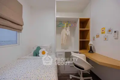 Charming small bedroom with cozy decor and functional workspace