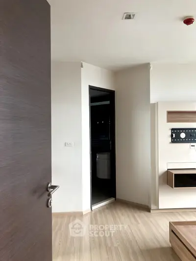 Modern interior with wooden flooring and built-in TV unit