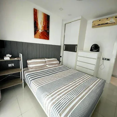 Modern bedroom with stylish decor and air conditioning in a contemporary apartment.