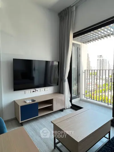 Modern living room with balcony view in urban apartment