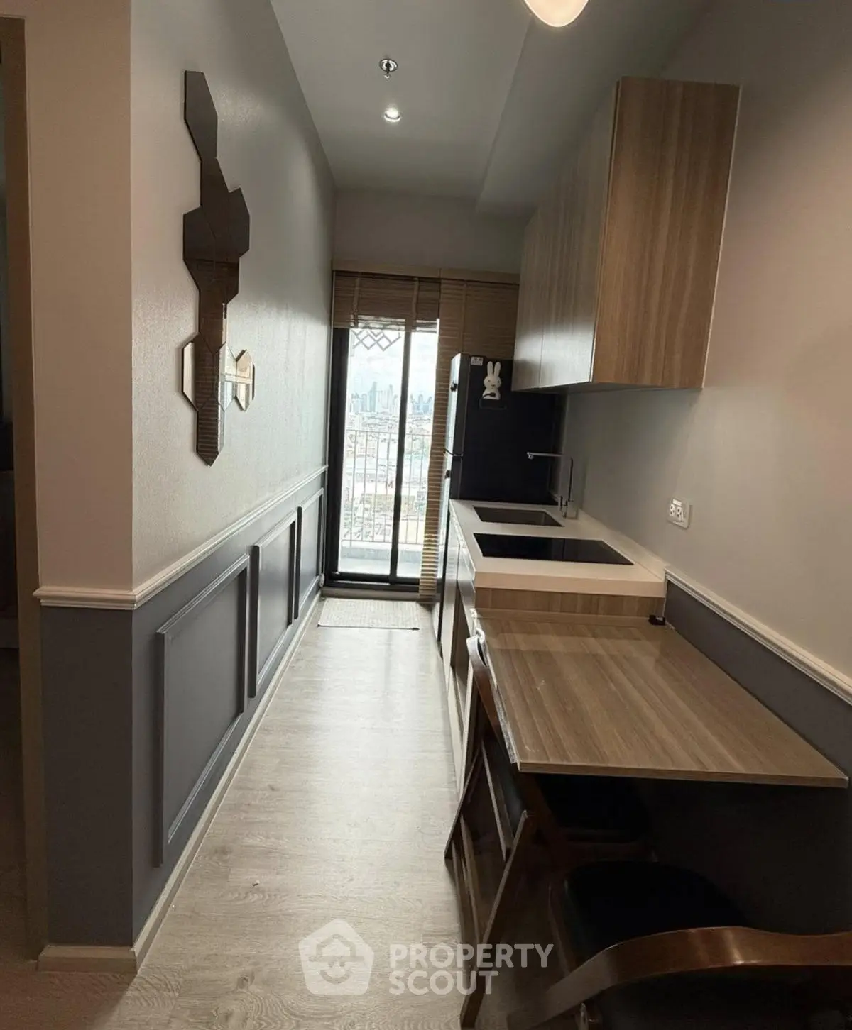 Modern kitchen with sleek design and city view from window