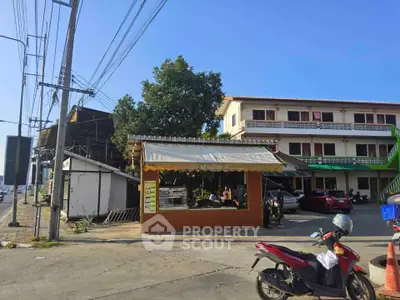 Charming mixed-use property with street-level retail and residential units above, ideal for investment.