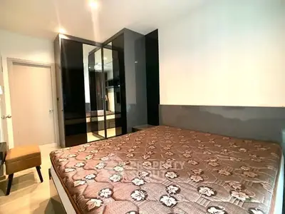 Modern bedroom with mirrored wardrobe and stylish decor