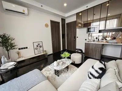 Modern living room with stylish decor and open kitchen layout