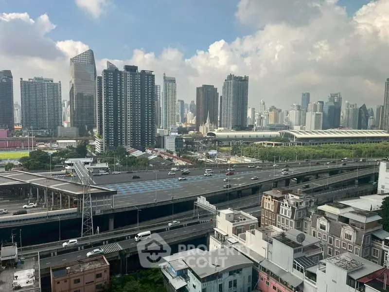 Stunning cityscape view from high-rise building with modern skyscrapers and busy highways.