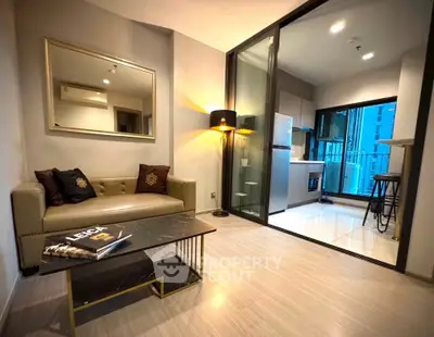 Modern living room with open kitchen and stylish decor in a high-rise apartment.