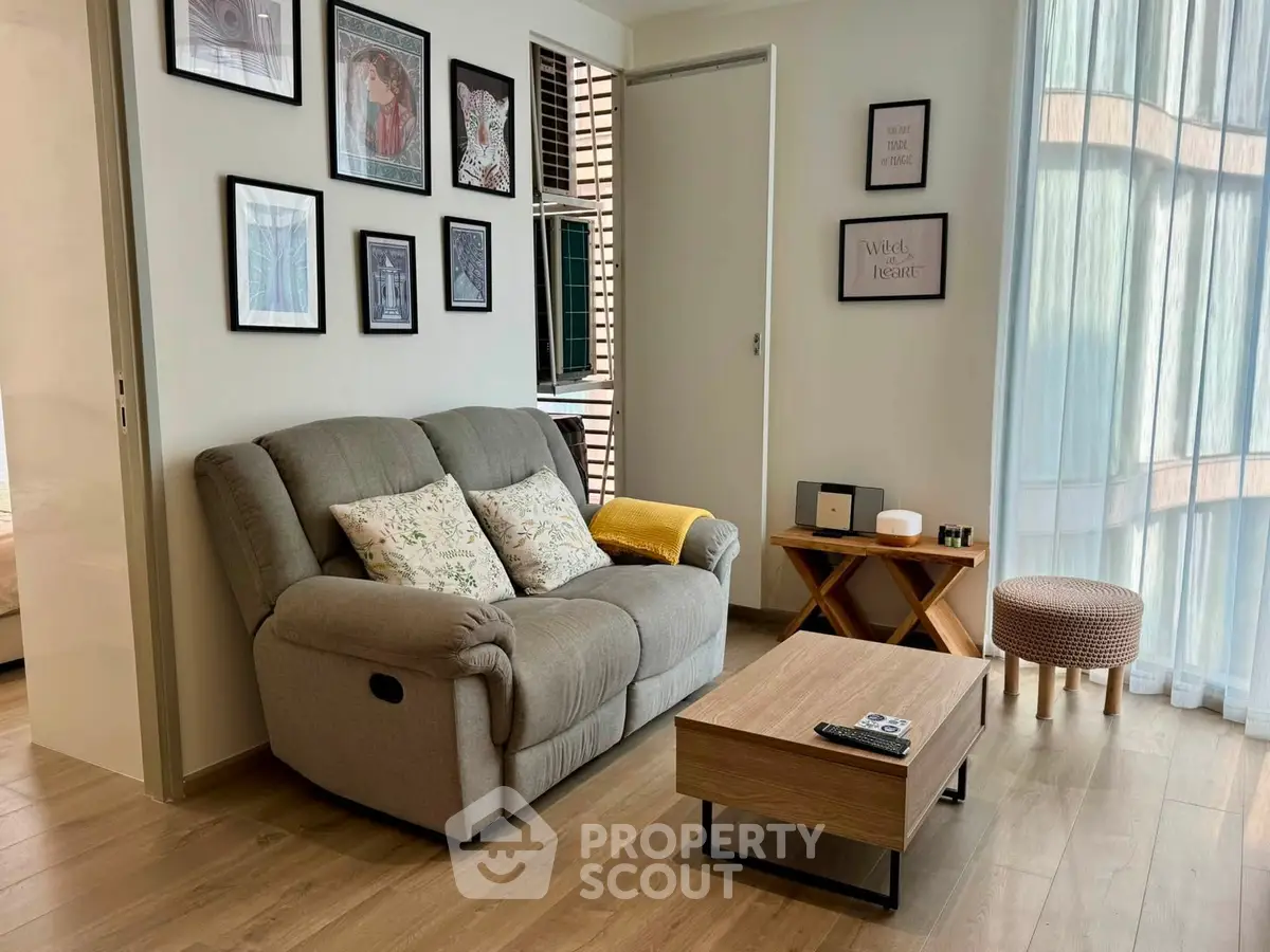 Cozy living room with stylish decor and natural light, featuring a comfortable sofa and modern coffee table.