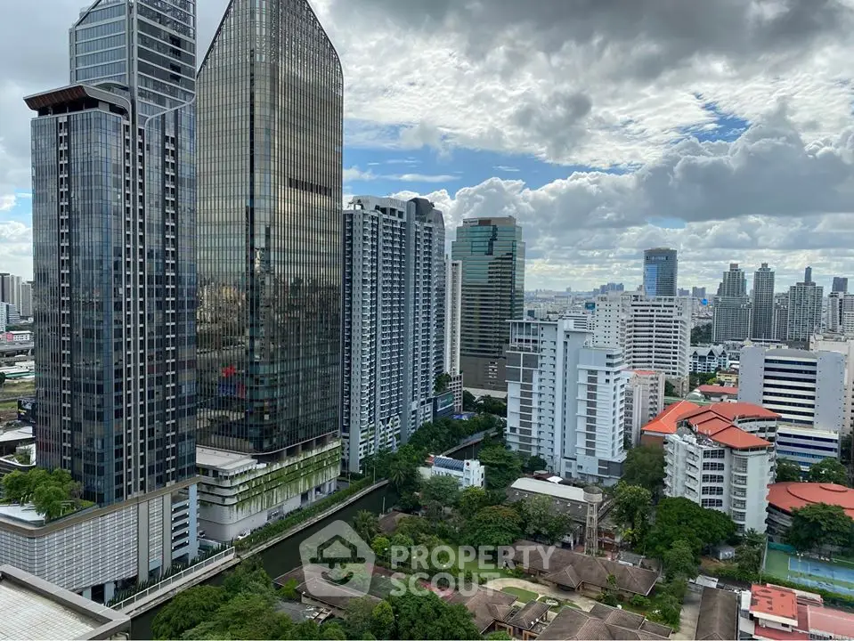 Stunning cityscape view with modern high-rise buildings and lush greenery.