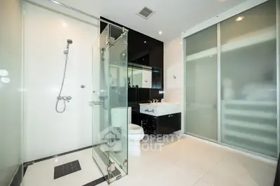 Luxurious modern bathroom with sleek glass shower and elegant fixtures