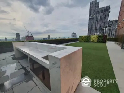 Luxurious rooftop with stunning city views and modern outdoor kitchen area.