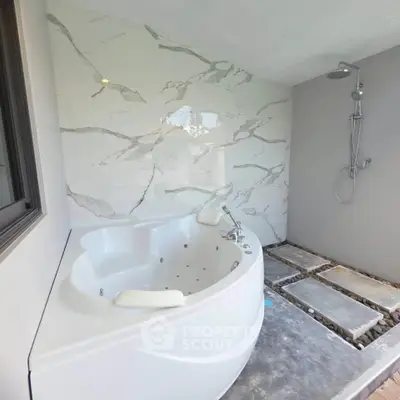 Luxurious bathroom with modern bathtub and sleek shower design
