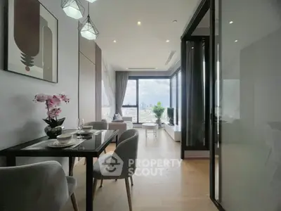 Modern dining area with city view, elegant decor, and natural light in a high-rise apartment.