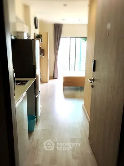Modern apartment entrance with open layout and natural light