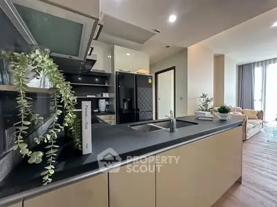 Modern kitchen with sleek design and open layout in stylish apartment.