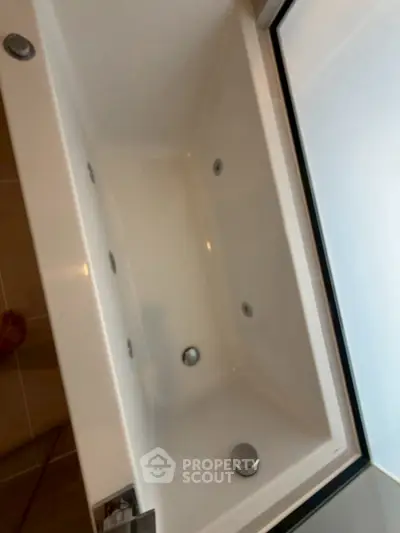 Luxurious bathroom with modern bathtub and sleek design, perfect for relaxation and comfort.