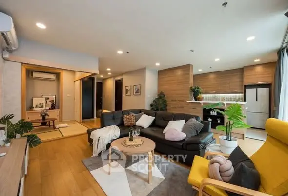 Spacious modern living room with open kitchen and stylish decor