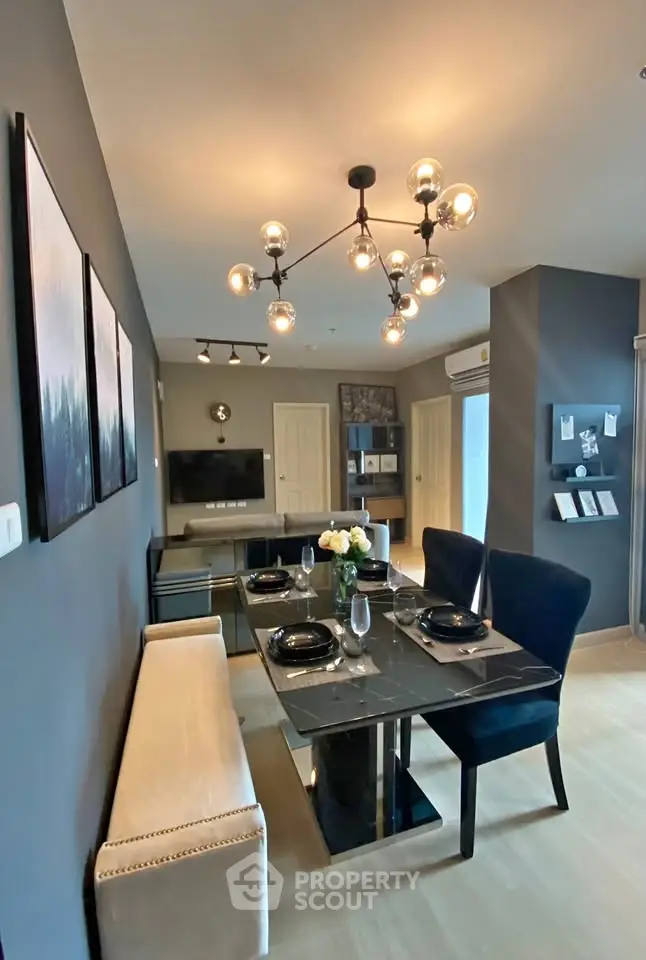 Modern dining area with elegant lighting and stylish decor in a contemporary apartment.