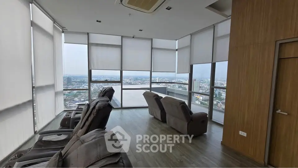 Luxurious high-rise lounge with panoramic city views and plush seating, perfect for relaxation and entertainment.
