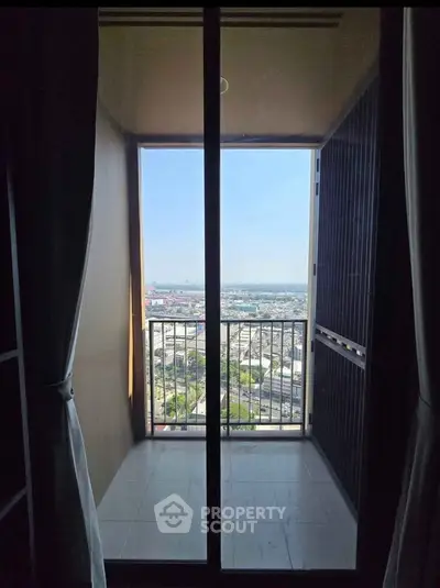 Charming balcony with panoramic city view, perfect for relaxation and enjoying the skyline.