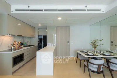 Modern kitchen and dining area with sleek design and open layout
