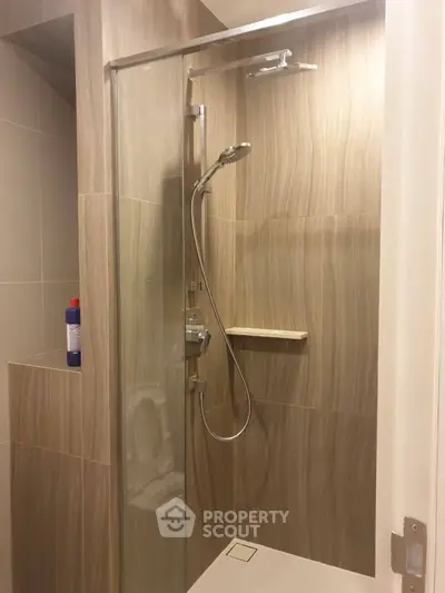 Modern bathroom with sleek shower design and elegant tile work.