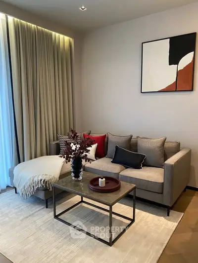 Stylish modern living room with cozy sofa, elegant decor, and natural light.