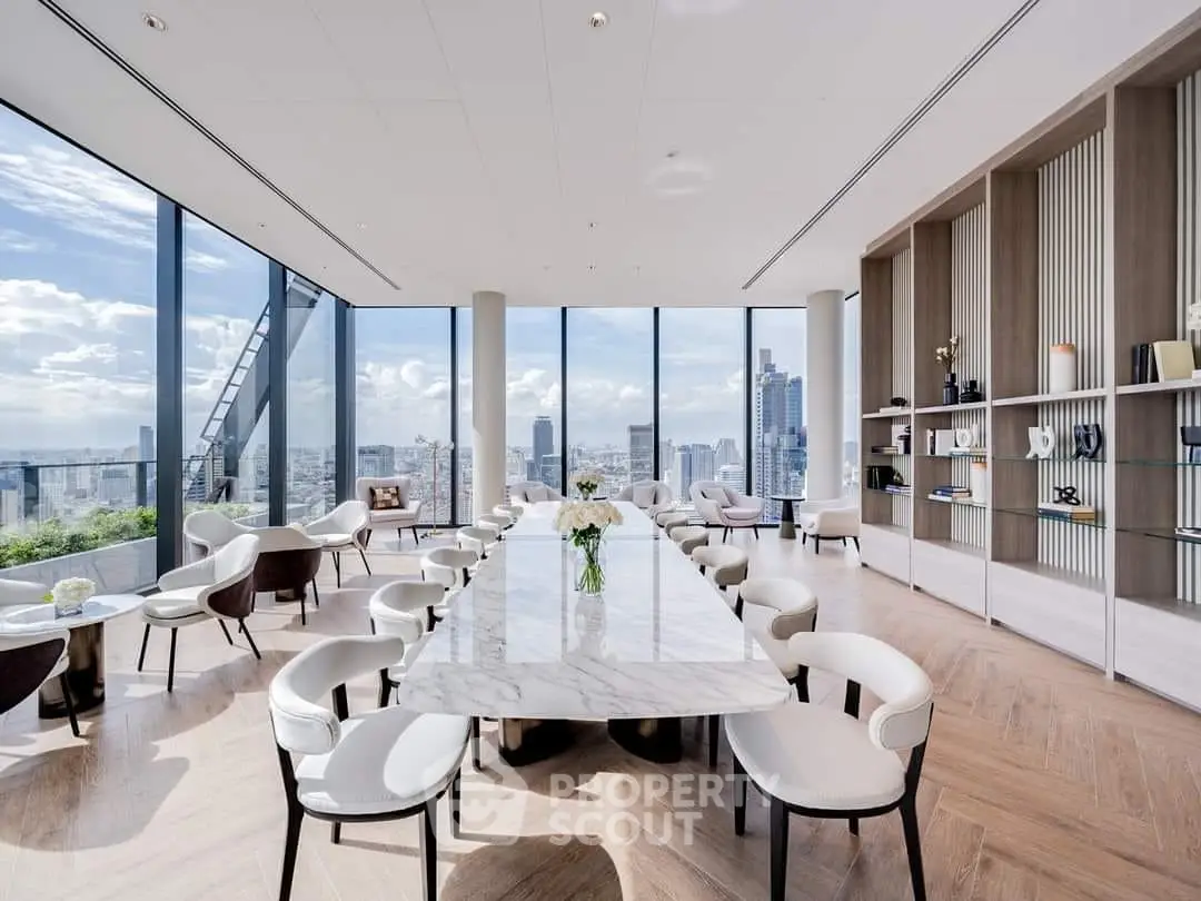 Luxurious modern dining area with panoramic city views and elegant marble table.