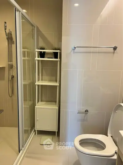 Modern bathroom with sleek shower and stylish shelving