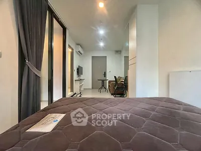 Modern studio apartment with open layout and stylish furnishings