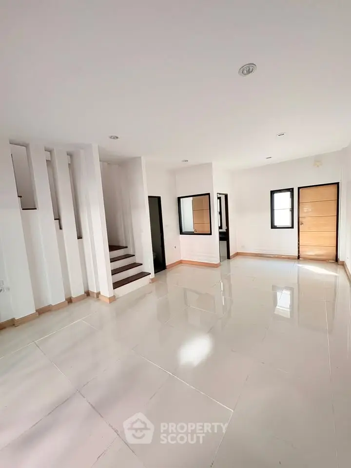 Spacious modern living room with sleek design and abundant natural light