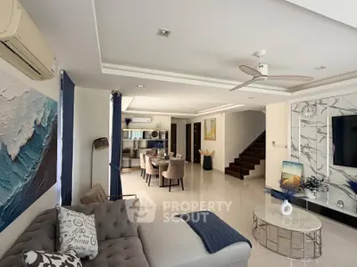 Spacious modern living room with elegant decor and open dining area