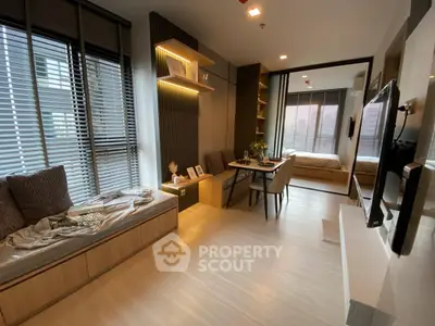 Modern open-plan living room with cozy seating and dining area