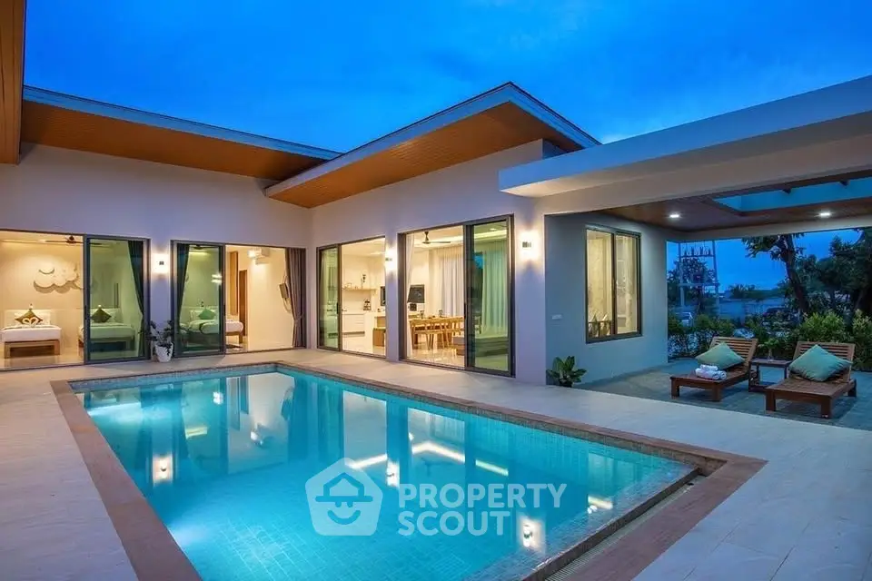Luxurious modern villa with private pool and stunning evening ambiance, perfect for relaxation and entertainment.