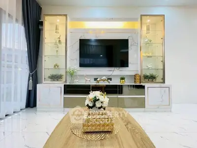 Luxurious living room with elegant decor and modern entertainment center