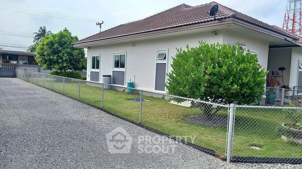 Charming single-story home with spacious yard and secure fencing in a serene neighborhood.