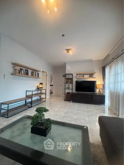 Spacious living room with modern decor and natural light