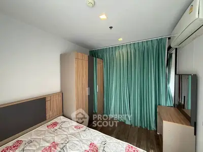 Modern bedroom with stylish wardrobe and air conditioning in a cozy apartment.