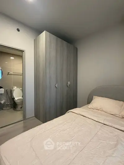 Cozy bedroom with ensuite bathroom and modern wardrobe