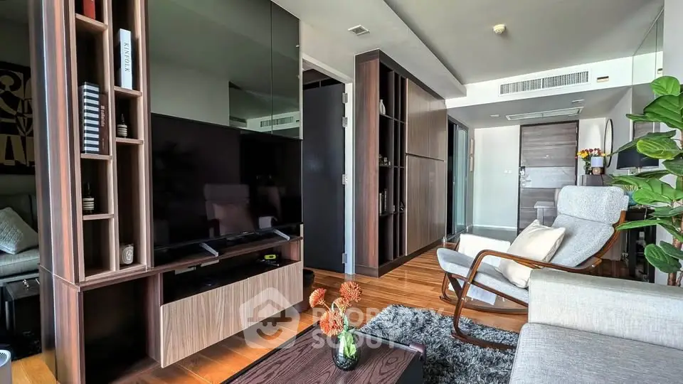 Modern living room with sleek wooden furniture and cozy seating area