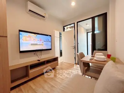 Modern living room with sleek furniture and wall-mounted TV, perfect for cozy relaxation.