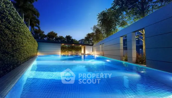 Luxurious outdoor pool with modern design and ambient lighting at night.