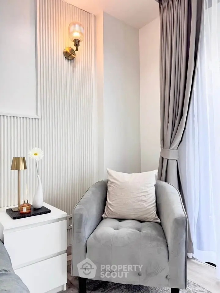 Elegant living room corner with plush armchair and stylish decor