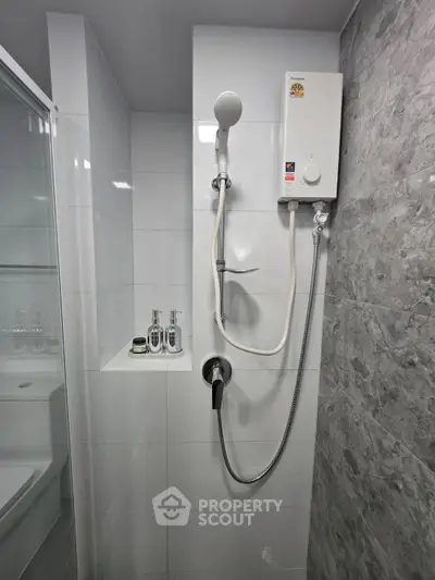 Modern bathroom with sleek shower and water heater installation