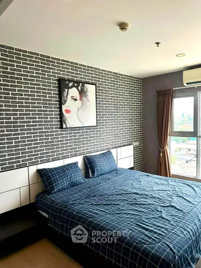 Modern bedroom with stylish brick accent wall and large window view.